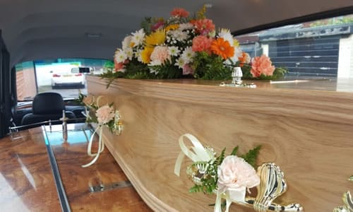 coffin inside the funeral car